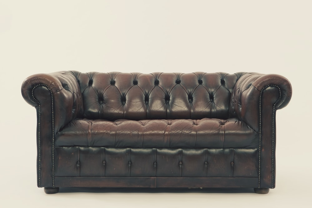 brown leather Chesterfield sofa