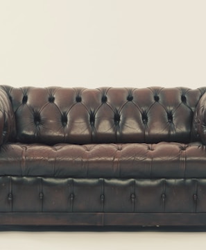 brown leather Chesterfield sofa