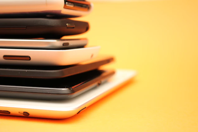 piled white and black Android smartphone