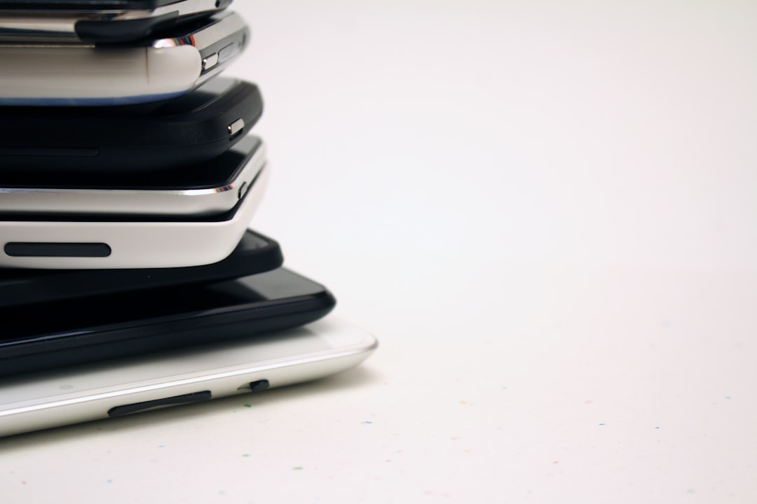 piled black and white smartphones