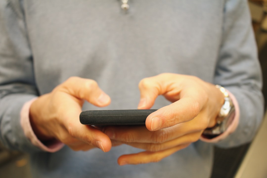 person holding black smartphone