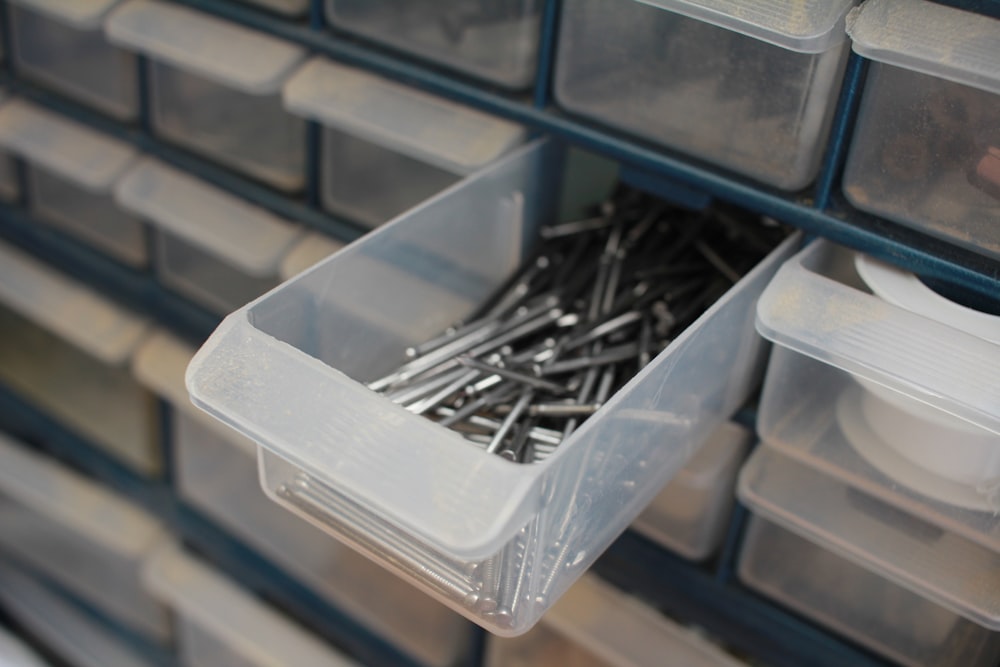 gray nails on clear container