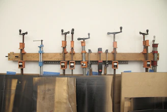 a bunch of tools are hanging on a wall