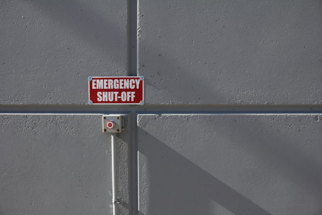 emergency shut-off button on wall