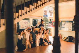 Students presenting a group history project with posters.