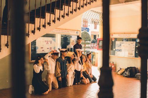 Students presenting a group history project with posters.
