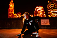 Evening shot of reflective details on activewear illuminated by city lights.