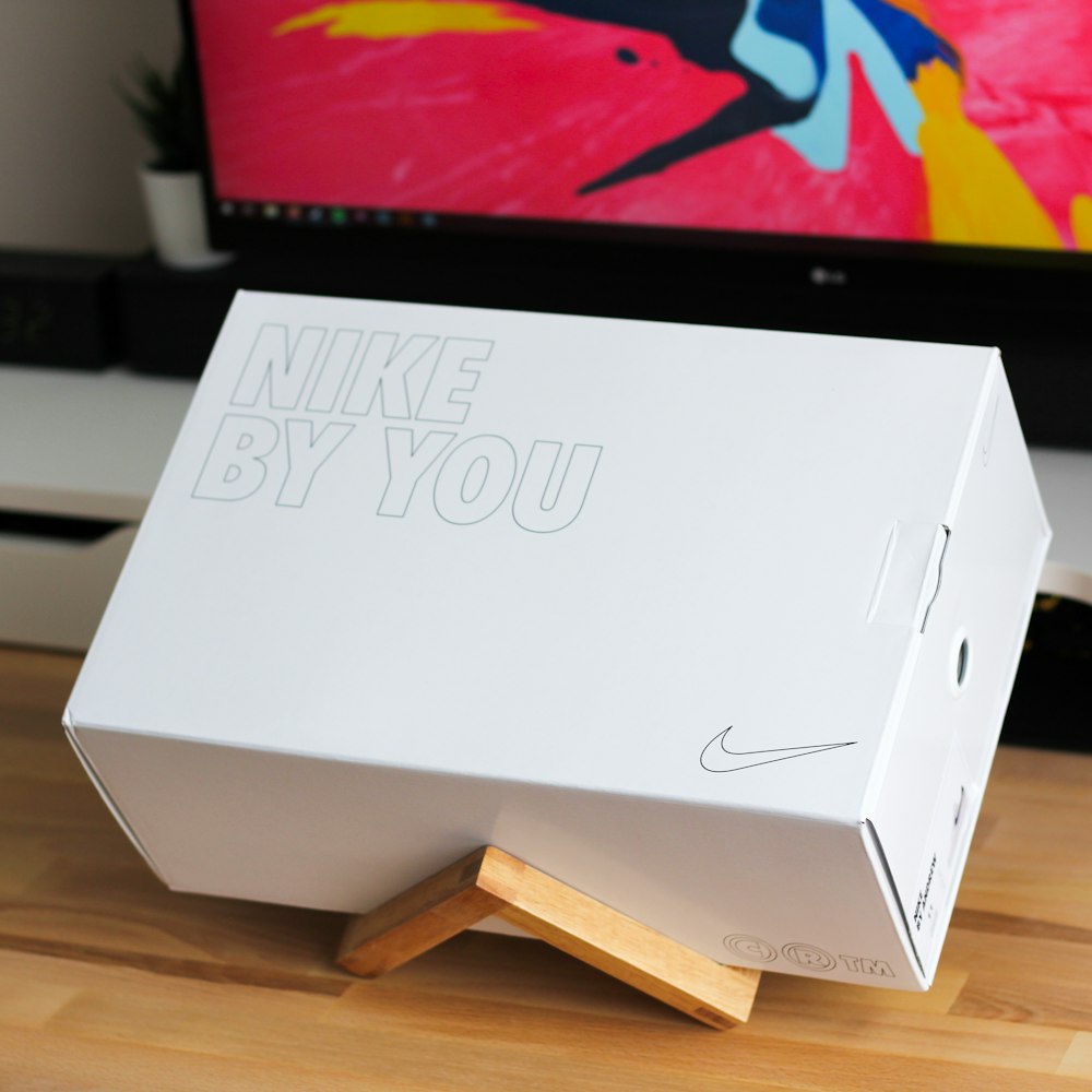 Download white Nike shoe box on brown wooden rack photo - Free Box ...