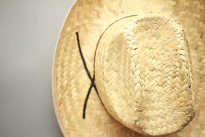 Close-up of a breathable fabric sun hat with a subtle solid color, perfect for summer outings.