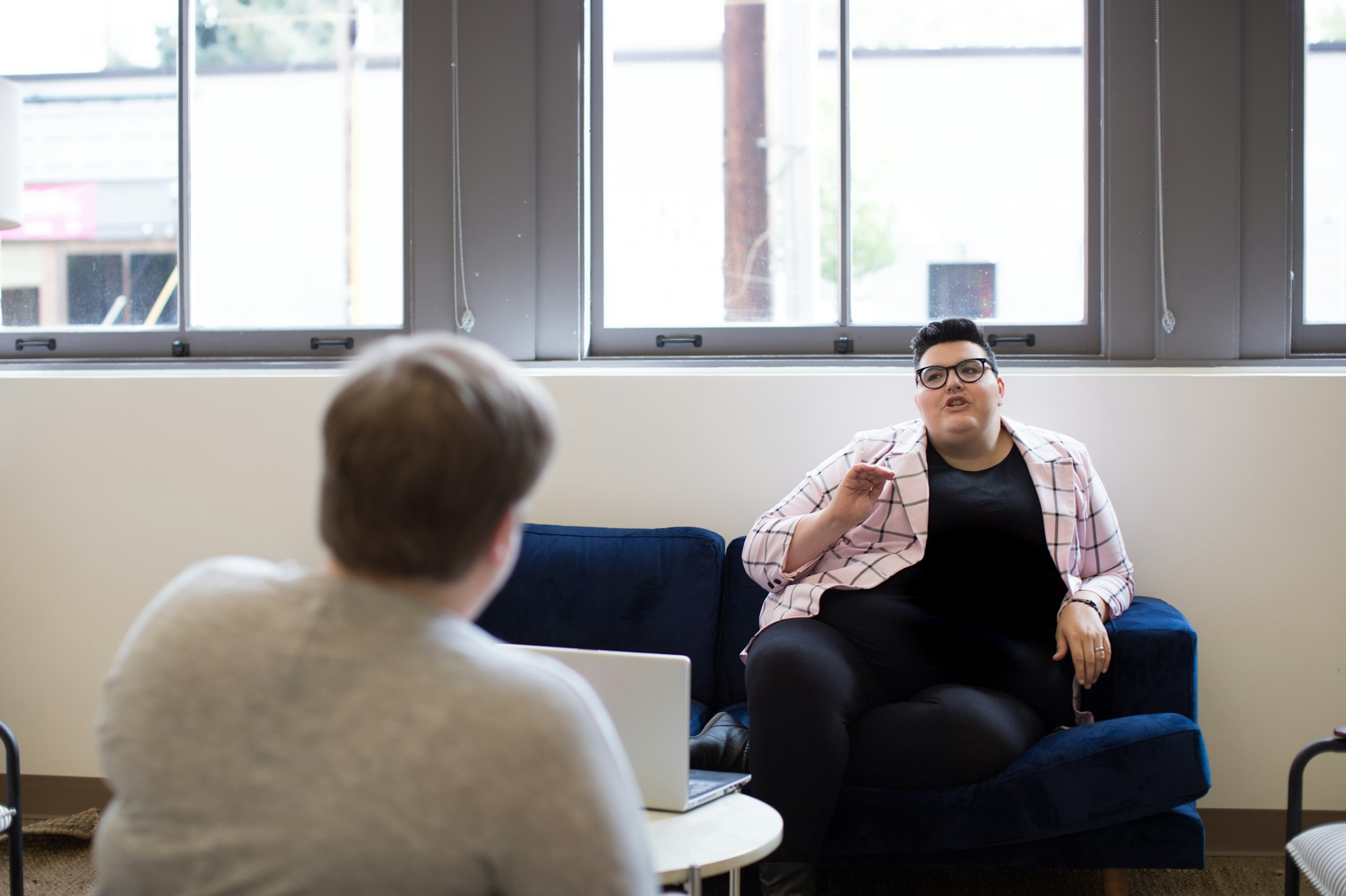 Plus size people at work in bright, open office workplace