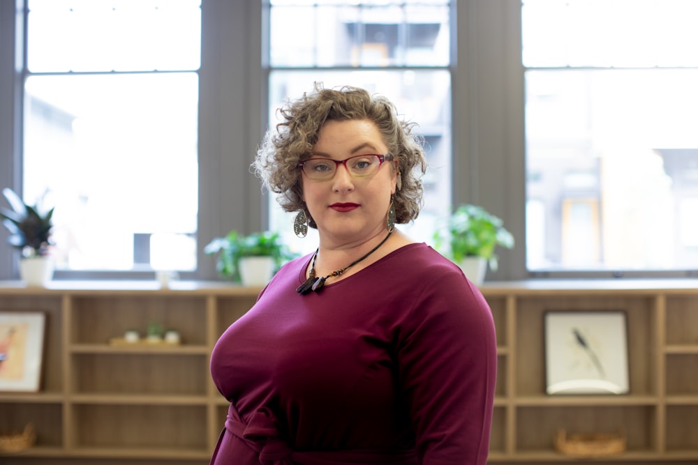 woman wearing red framed eyeglasses