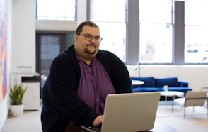 close-up photography of man using laptop
