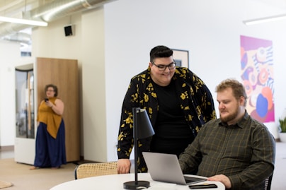 man using laptop on desk