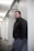 man leaning on wall
