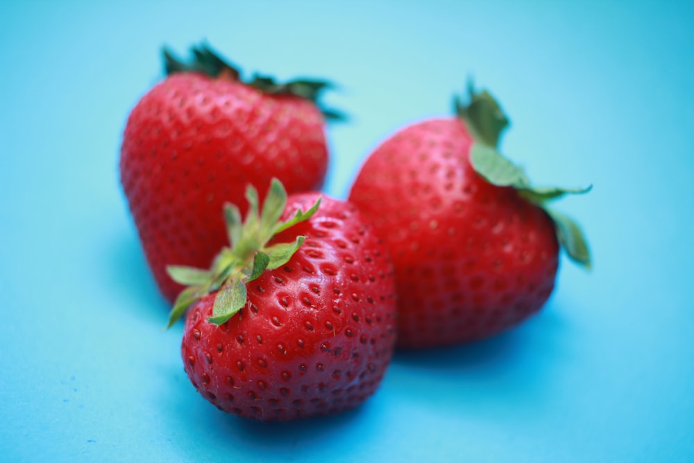 three red strawberries