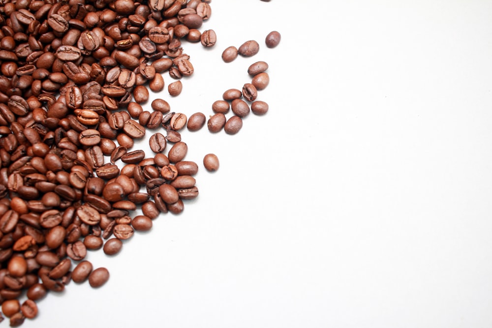 bunch of coffee beans on white background