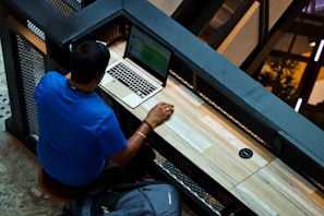 man using laptop on desk