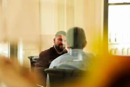 man sitting indoors