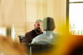 man sitting indoors