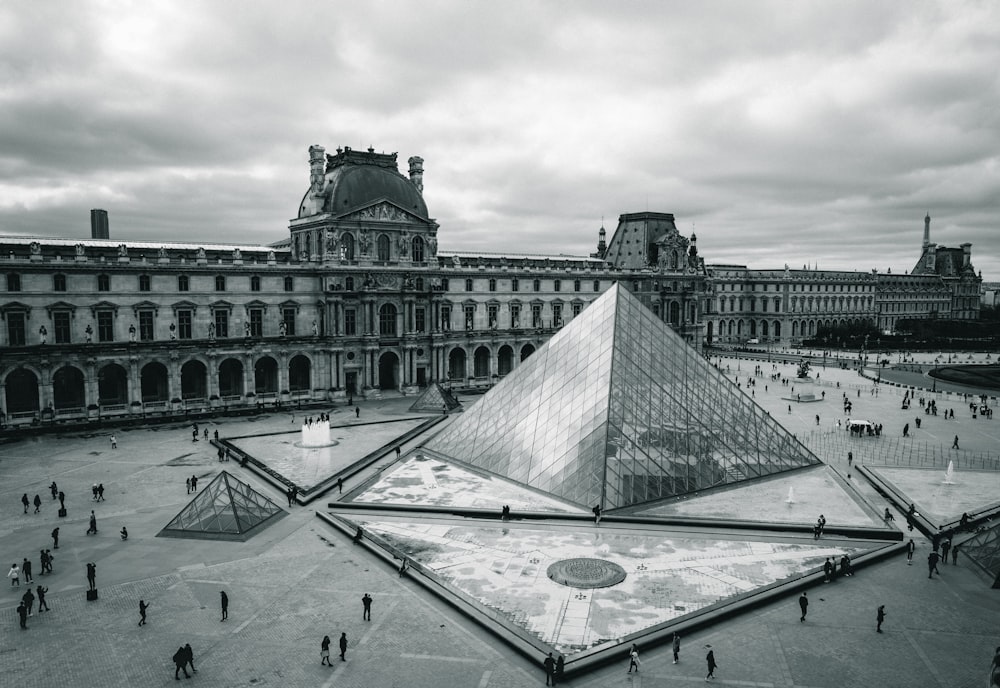 a large building with a pyramid in the middle of it
