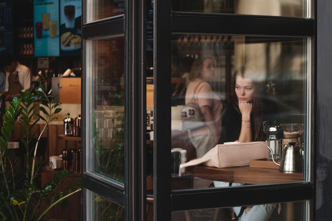 woman sitting infront of table