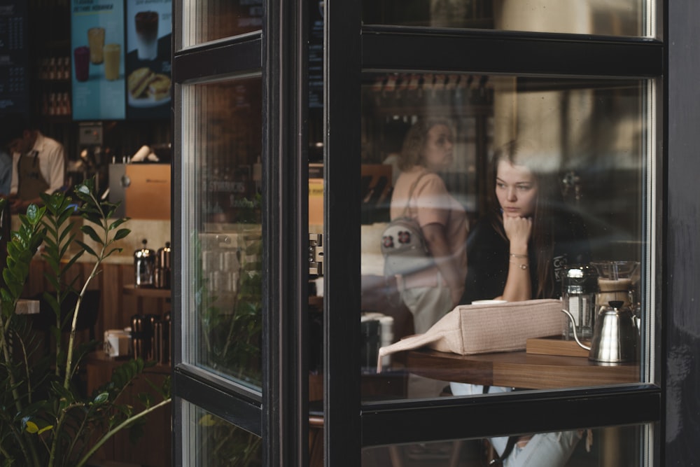 woman sitting infront of table