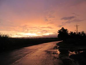 Sunset view over rural roads constructed by MM Agroservicios, highlighting smooth access paths
