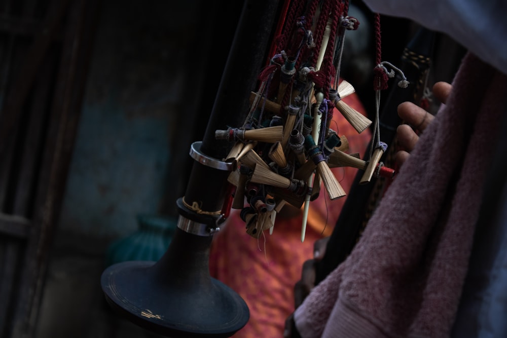 a close up of a person holding a bell