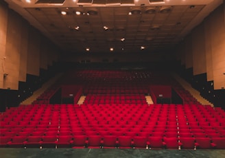 landscape photography of red seats inside a theater