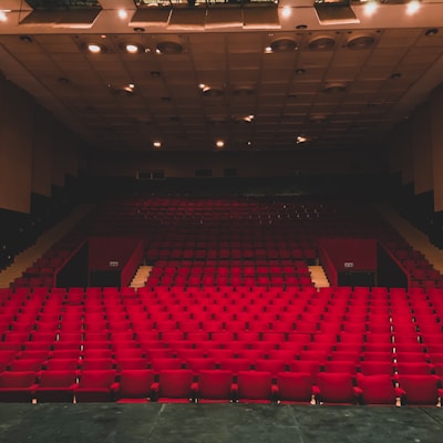 landscape photography of red seats inside a theater