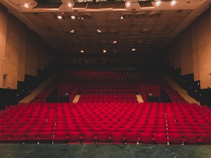 landscape photography of red seats inside a theater