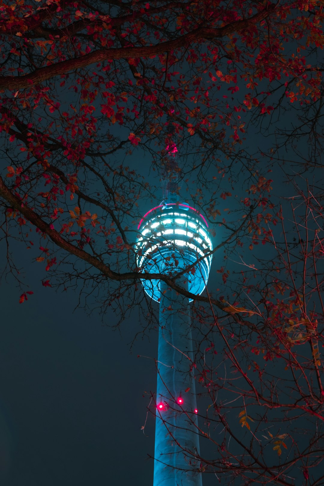 low-angle photography of a lighted tower during nighttime