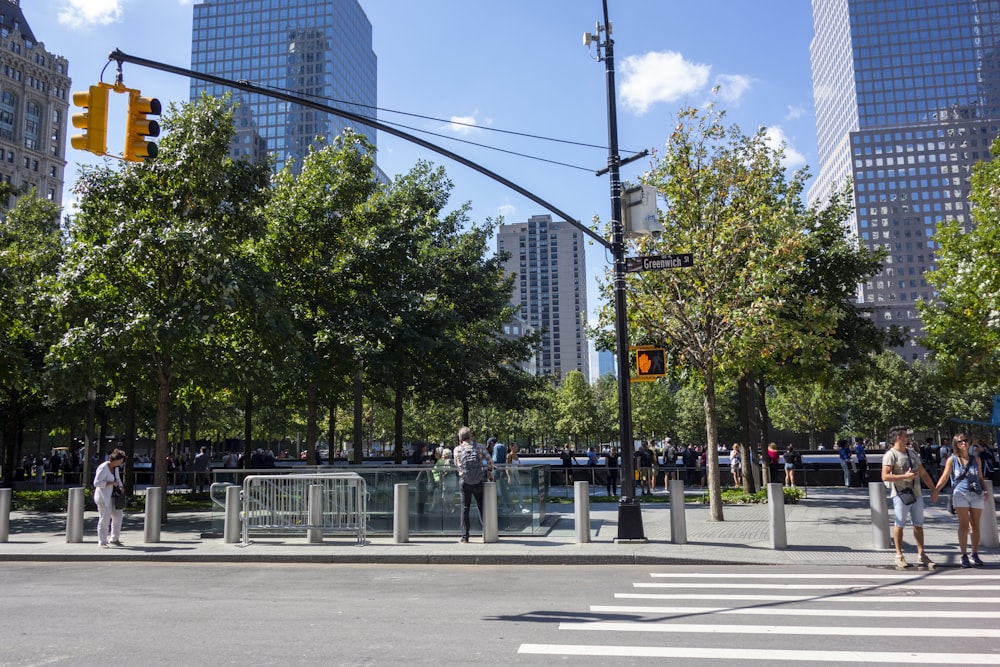 people walking on road near buildings during daytime