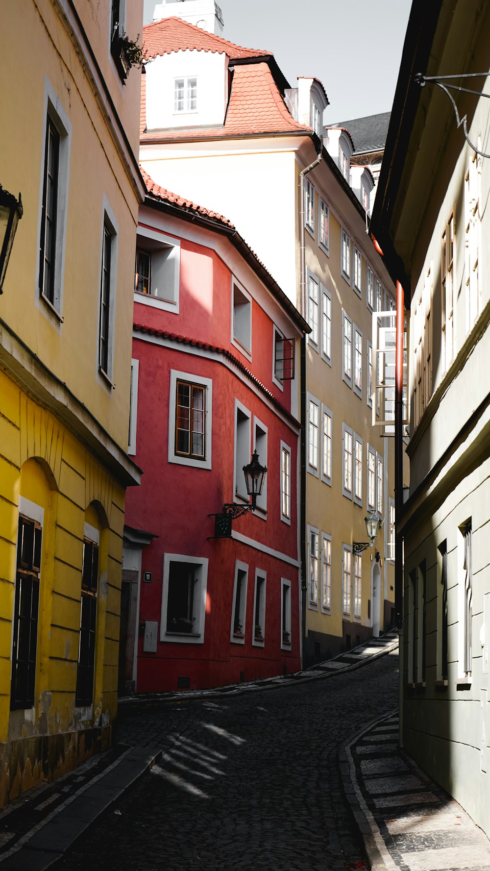 white, red, and yellow concrete buildings