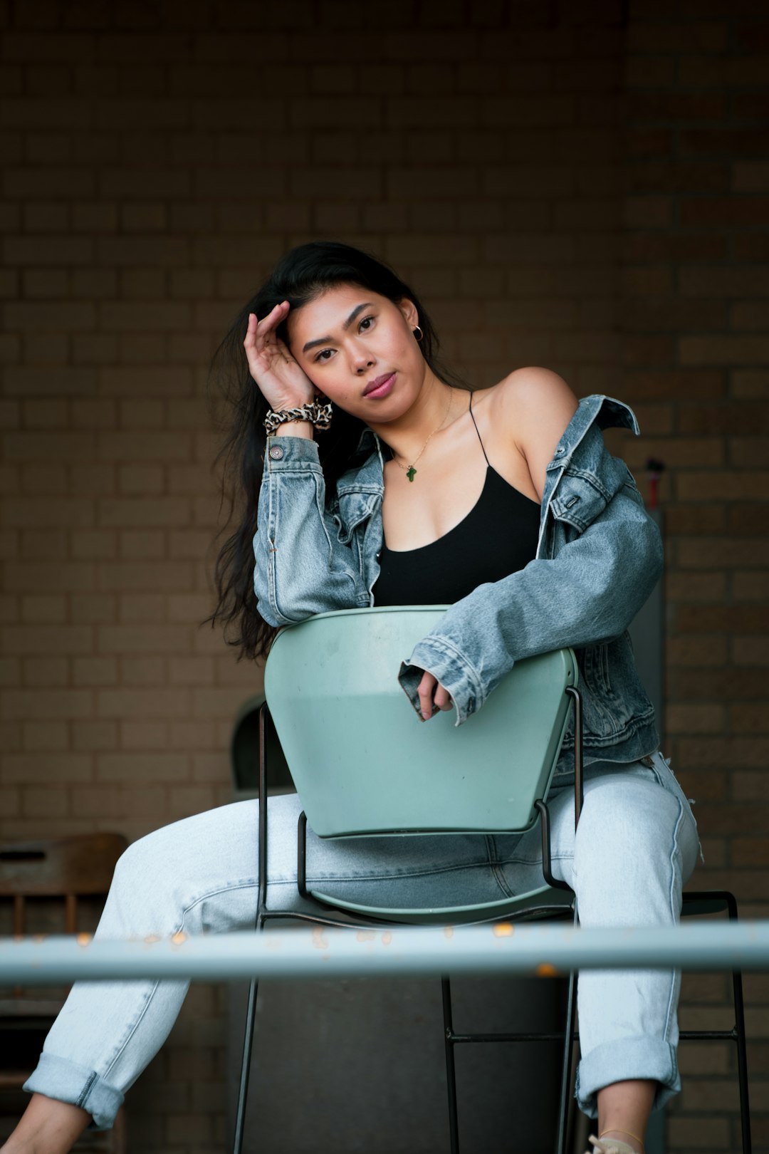 woman sitting backwards on chair