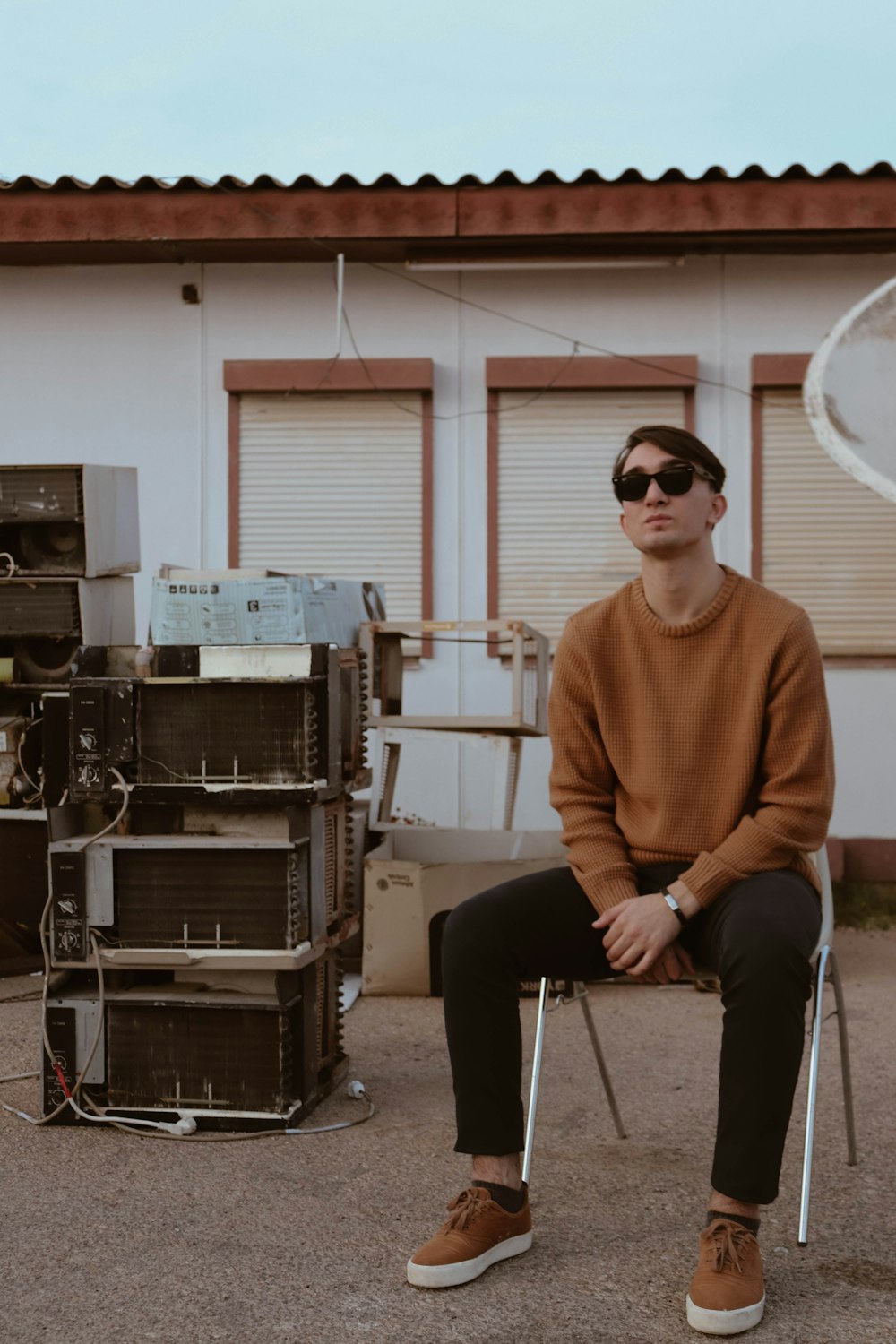 man sitting on chair outside