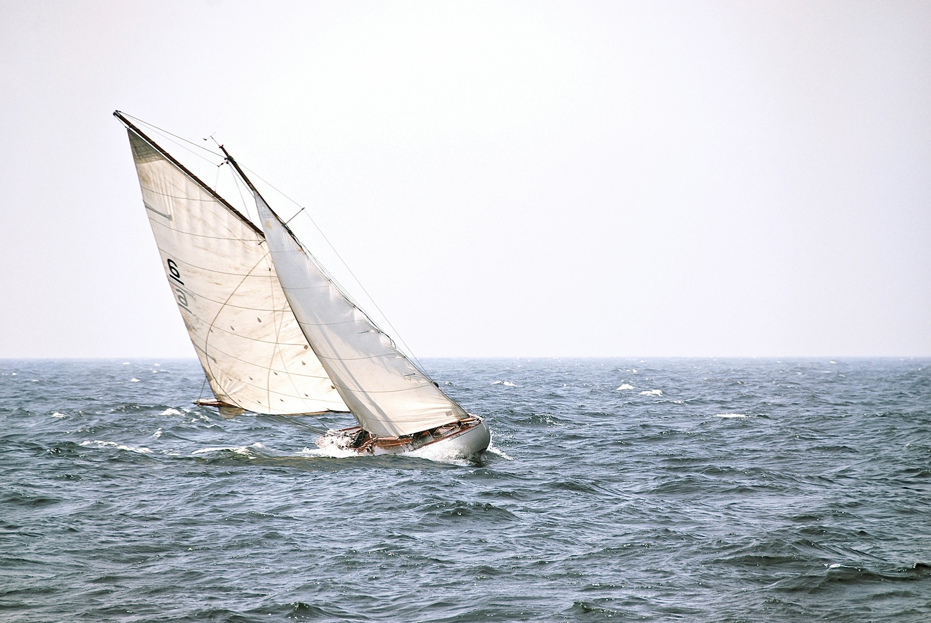 white boat on the body of water