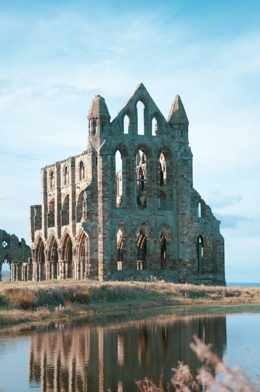 Whitby Abbey Monastery in Whitby, England under blue and white sky