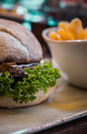 Close-up of a delicious, hearty sandwich with fresh ingredients and a side of crispy fries.