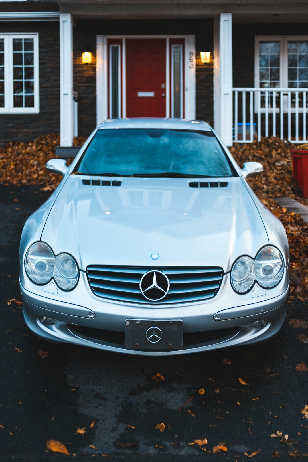 silver Mercedes-Benz park in front of the house