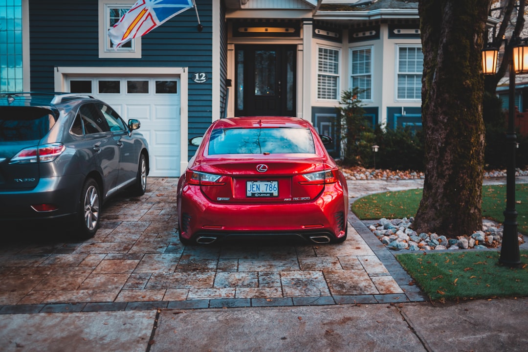 parked red Lexus RC 300 in front of house