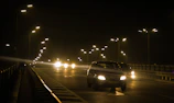 Night view of illuminated road markings enhancing visibility on Riyadh roads.