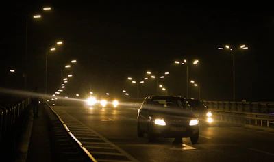 Night view of illuminated road markings enhancing visibility on Riyadh roads.