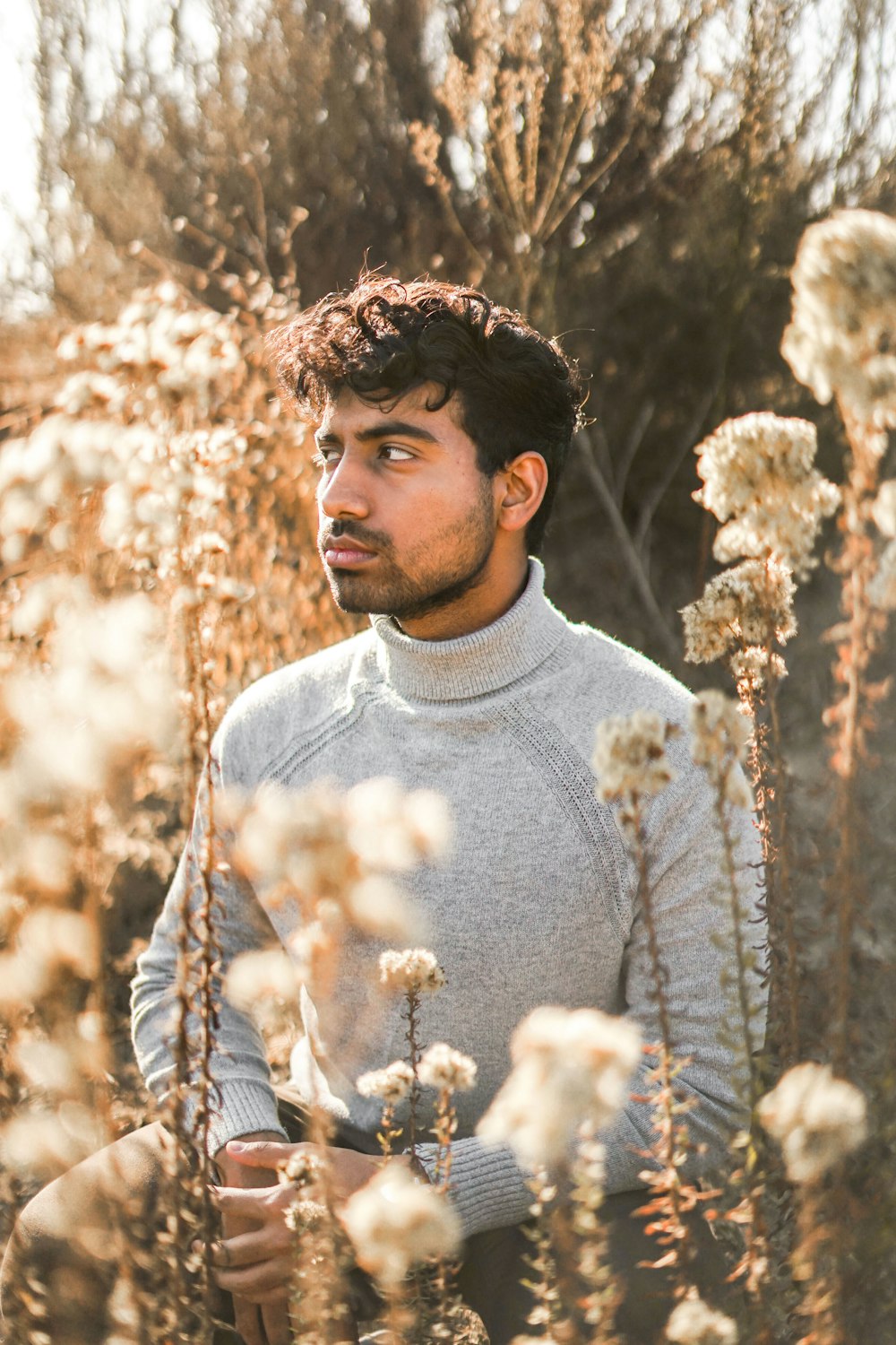 man in gray crew-neck sweater