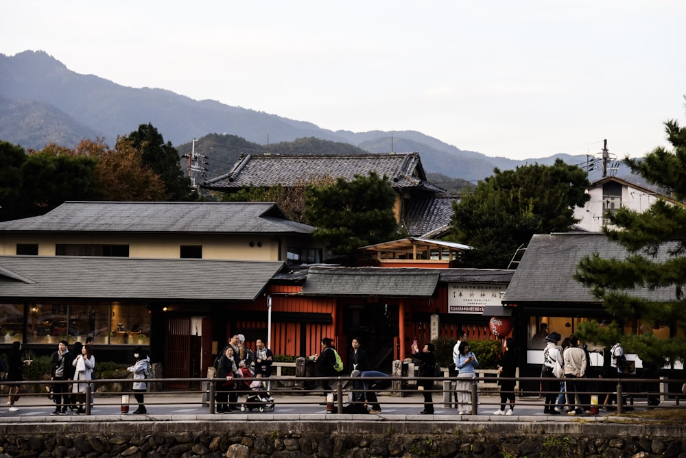 people standing beside building during daytime