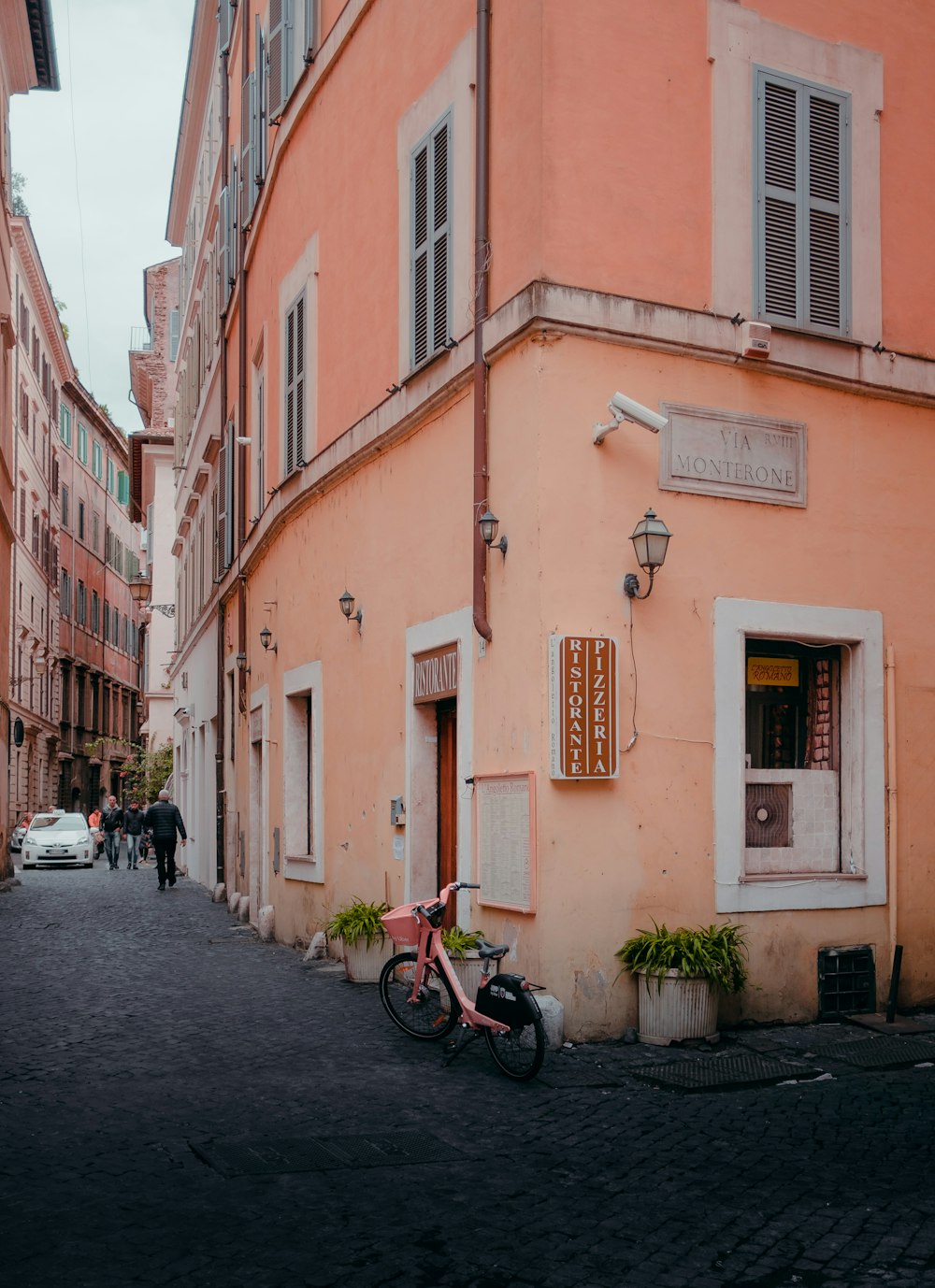 view photography of bicycle beside building during daytime