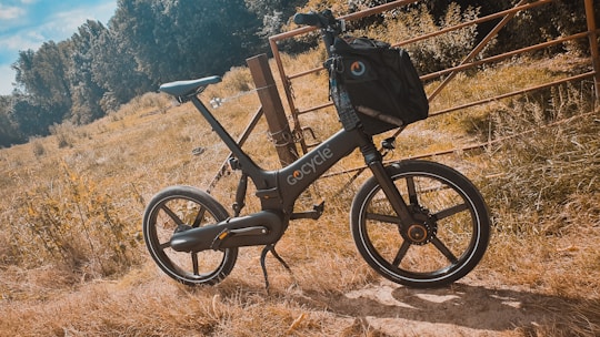 A modern bike ready for rental with a scenic background.