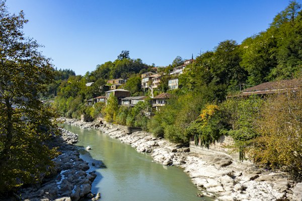 Canal beside trees and house — Kutaisi, Georgia