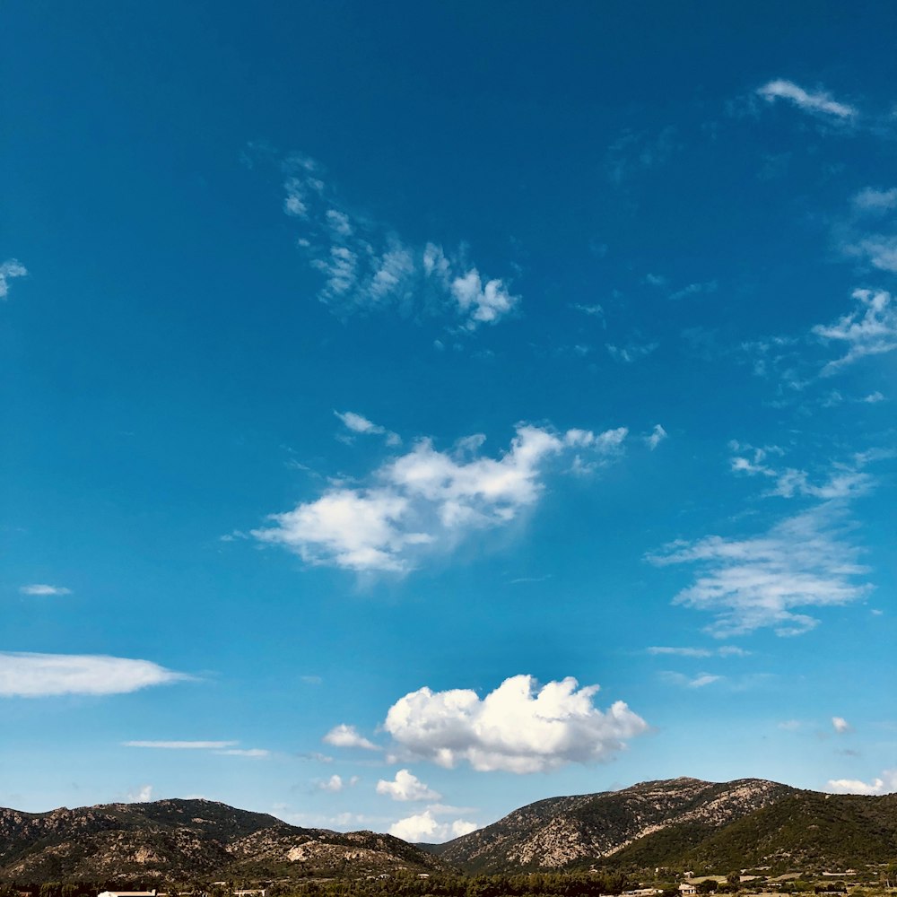 mountains under blue skies during daytime