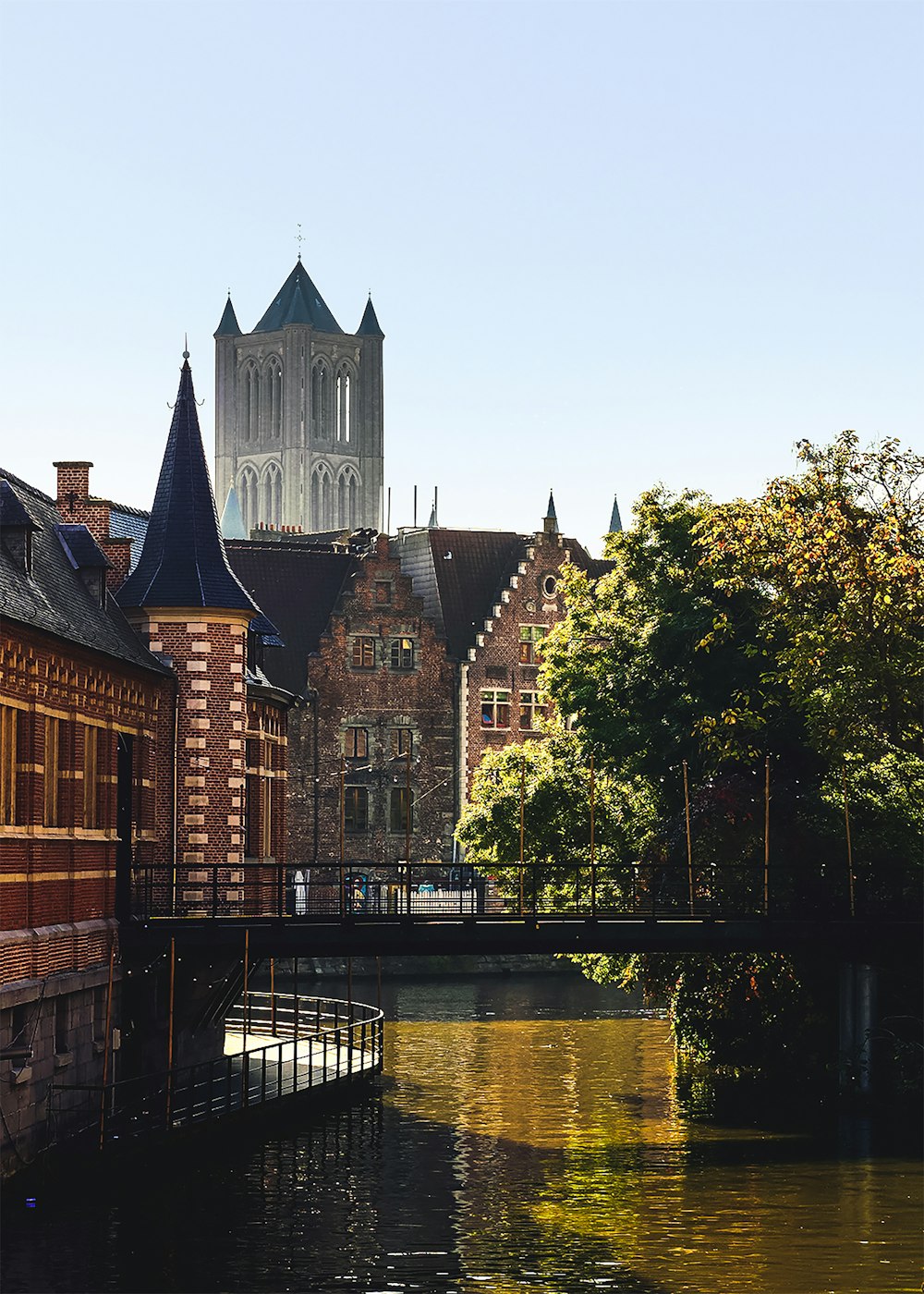 body of water by buildings during daytime